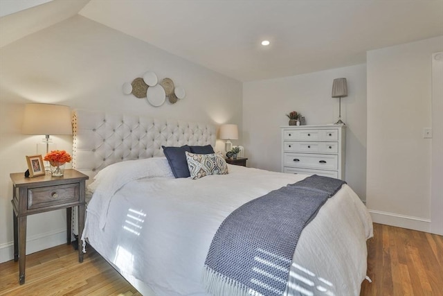 bedroom with light wood finished floors, recessed lighting, and baseboards