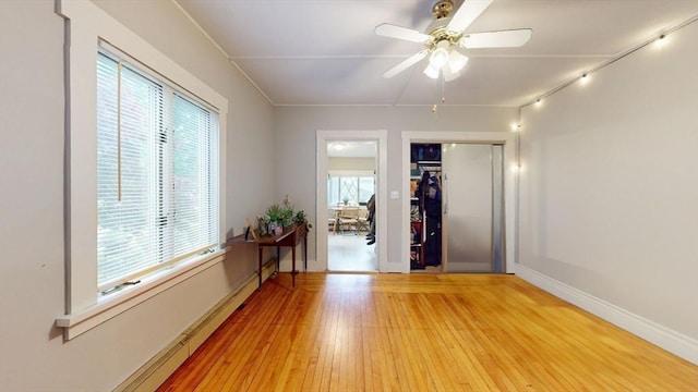 142 Dale St, Waltham, MA 02451 - unfurnished room featuring light wood finished floors, rail lighting, a ceiling fan, and baseboards