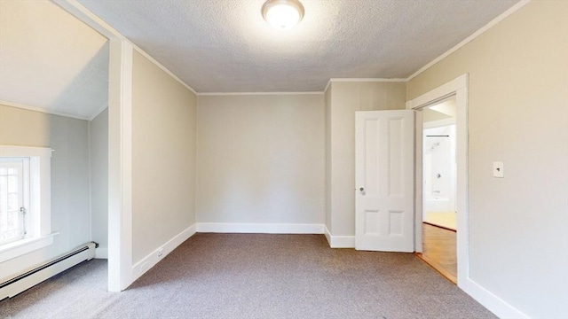142 Dale St, Waltham, MA 02451 - carpeted empty room with a baseboard heating unit, a textured ceiling, crown molding, and baseboards