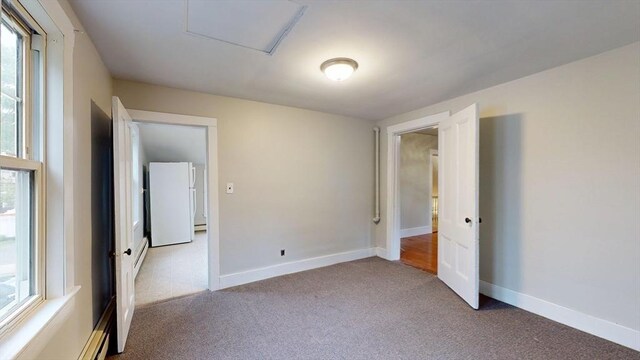 142 Dale St, Waltham, MA 02451 - carpeted empty room featuring healthy amount of natural light and baseboards