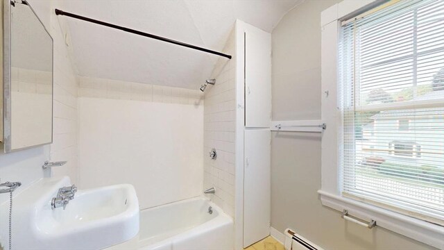142 Dale St, Waltham, MA 02451 - bathroom with lofted ceiling, healthy amount of natural light, bathtub / shower combination, a sink, and baseboards