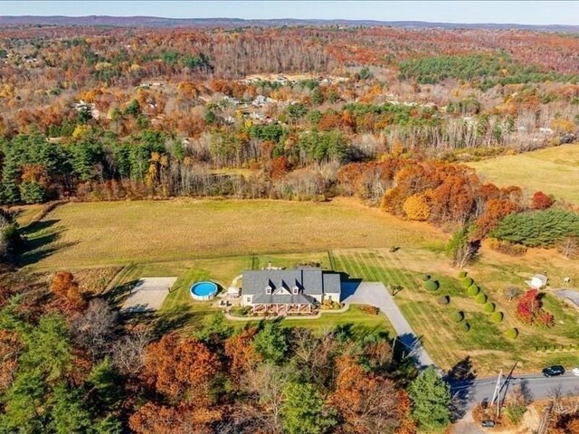143 Clemence Hill Rd, Southbridge, MA 01550 - aerial view of property and surrounding area with a heavily wooded area
