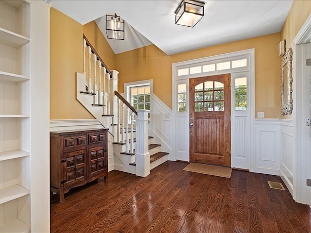 foyer entrance with dark hardwood / wood-style flooring