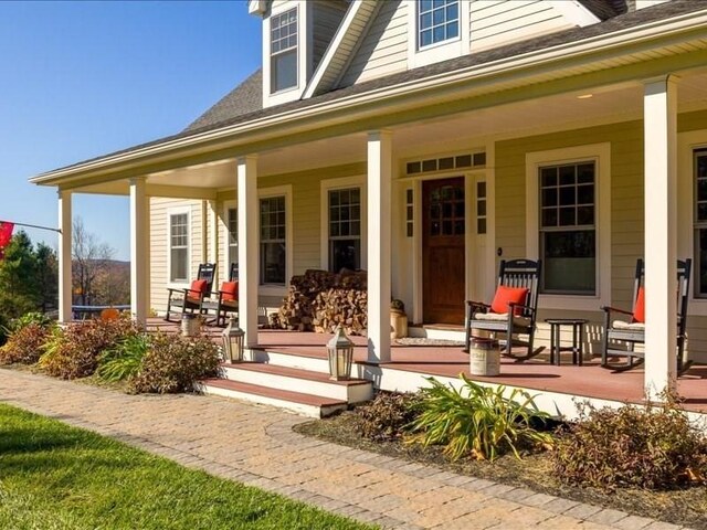143 Clemence Hill Rd, Southbridge, MA 01550 - entrance to property with a porch and roof with shingles