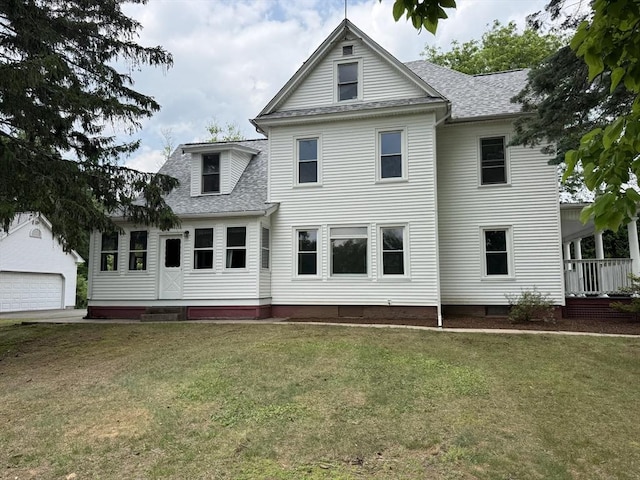 117 Rogers, West Springfield, MA 01089 - view of front facade with roof with shingles, a front lawn, and a detached garage