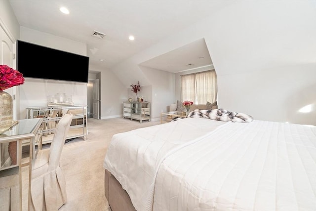 carpeted bedroom with lofted ceiling