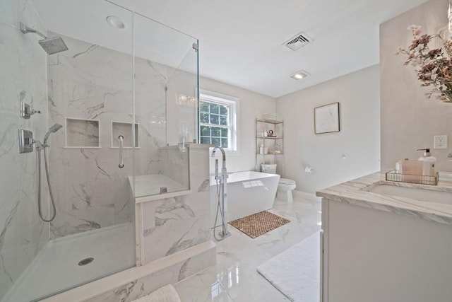 bathroom with vanity, an enclosed shower, and toilet