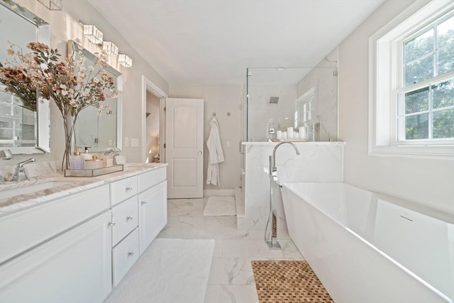 bathroom with vanity and independent shower and bath