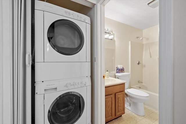 laundry room featuring stacked washing maching and dryer