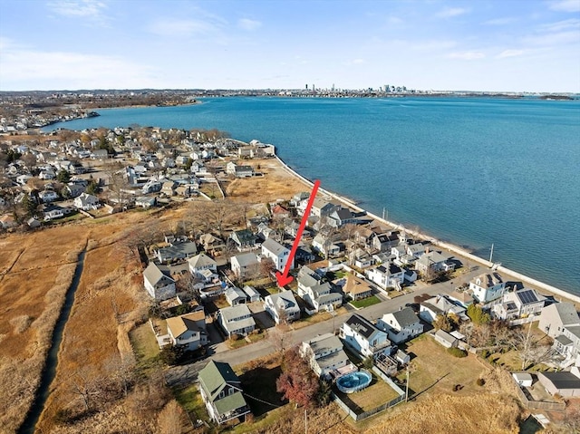 birds eye view of property with a water view