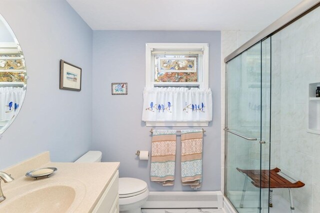 bathroom featuring vanity, toilet, marble finish floor, and a shower stall