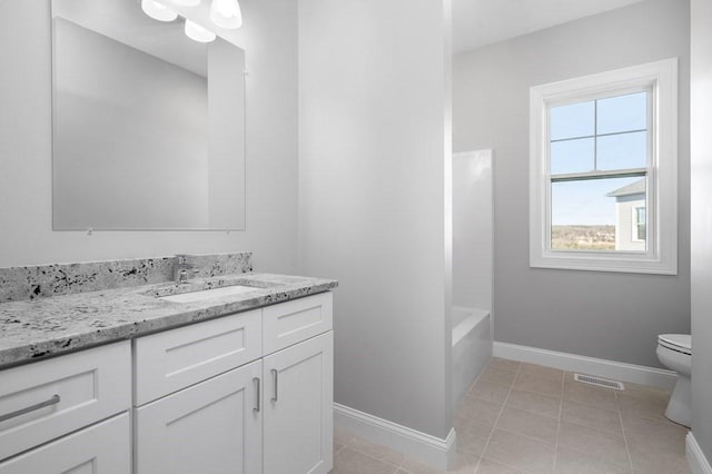 full bathroom featuring visible vents, toilet, vanity, baseboards, and tile patterned floors