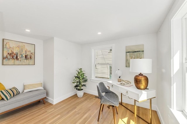 office space with baseboards, recessed lighting, and light wood finished floors