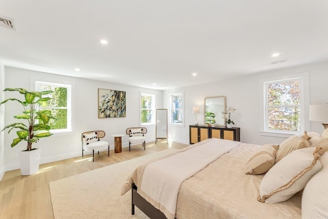bedroom with visible vents, recessed lighting, and light wood-style flooring