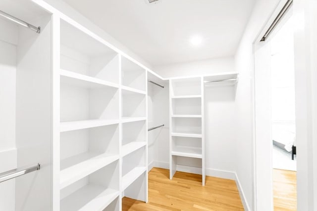 spacious closet with light wood-style flooring