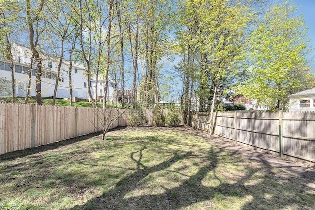 view of yard featuring a fenced backyard