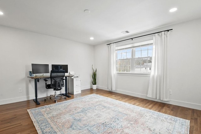 office space featuring baseboards, visible vents, wood finished floors, and recessed lighting