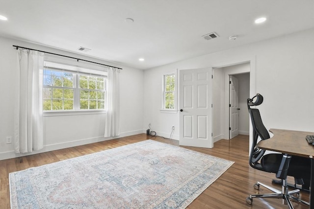 office area with recessed lighting, visible vents, baseboards, and wood finished floors