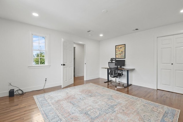 office area with recessed lighting, visible vents, baseboards, and wood finished floors