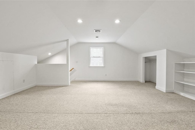 bonus room with lofted ceiling, baseboards, visible vents, and recessed lighting