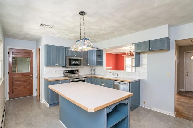 kitchen featuring a kitchen island, backsplash, open shelves, and appliances with stainless steel finishes