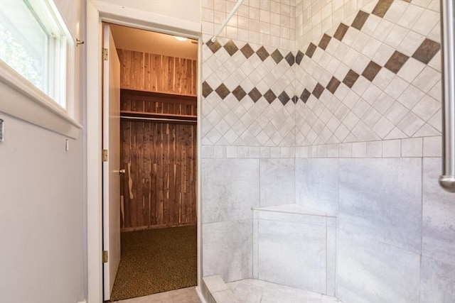 bathroom with a tile shower