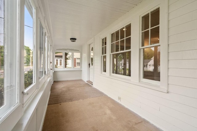 14 E Division St, Holbrook, MA 02343 - unfurnished sunroom with carpet and wood walls