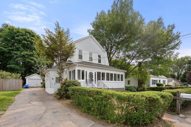 14 E Division St, Holbrook, MA 02343 - view of front of property featuring an outdoor structure and a garage