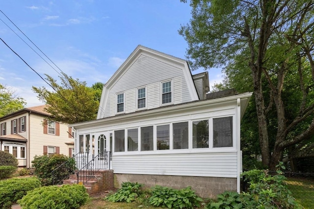 14 E Division St, Holbrook, MA 02343 - colonial inspired home with a gambrel roof and a sunroom