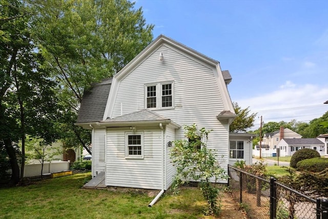 14 E Division St, Holbrook, MA 02343 - back of house with a gambrel roof and roof with shingles