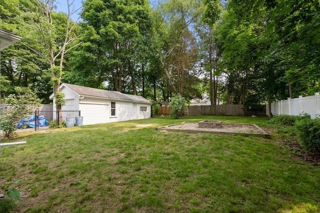 14 E Division St, Holbrook, MA 02343 - view of yard featuring a fire pit and an outbuilding