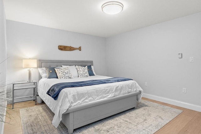 bedroom with wood-type flooring