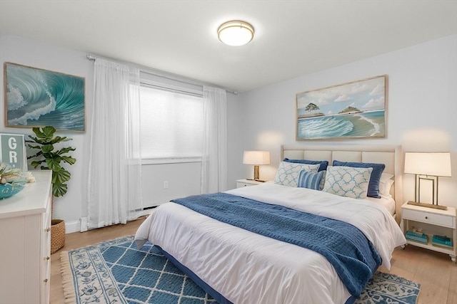 bedroom with hardwood / wood-style flooring