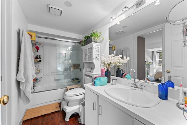 2A Brewer St, Boston, MA 02130 - full bathroom with toilet, vanity, wood finished floors, and enclosed tub / shower combo