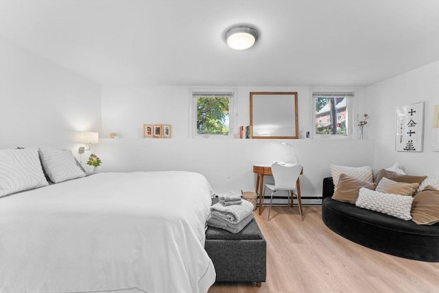 2A Brewer St, Boston, MA 02130 - bedroom featuring wood finished floors, multiple windows, and a baseboard radiator