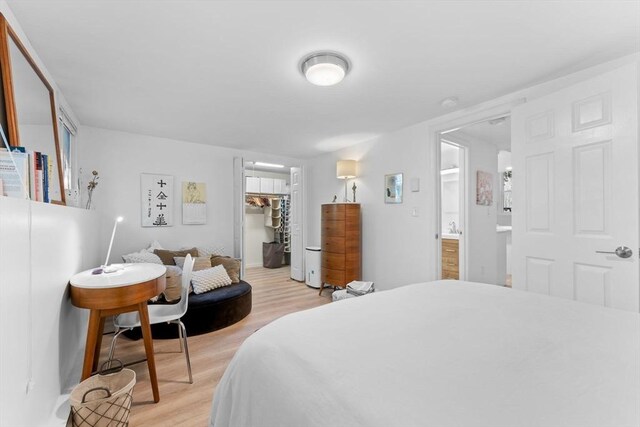 2A Brewer St, Boston, MA 02130 - bedroom with light wood-type flooring, a spacious closet, a closet, and ensuite bathroom
