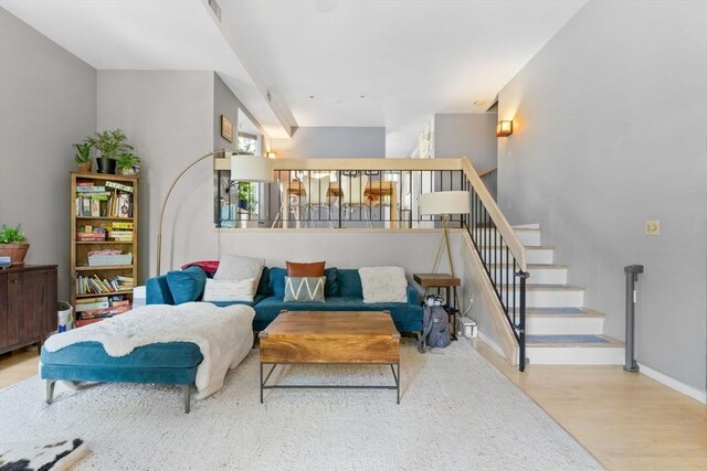 2A Brewer St, Boston, MA 02130 - living area with wood finished floors, baseboards, and stairs