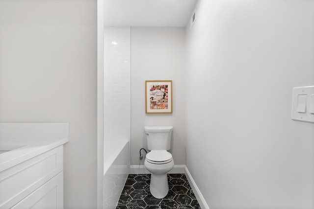 full bathroom with tile patterned floors, shower / washtub combination, vanity, and toilet