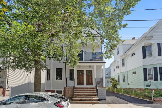 view of front of home with a balcony