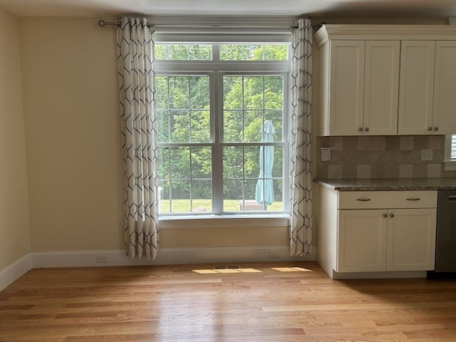61 School St Unit B, Natick, MA 01760 - entryway with plenty of natural light and light wood-style floors