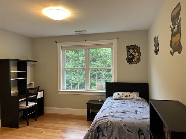 61 School St Unit B, Natick, MA 01760 - bedroom with light wood-type flooring and baseboards