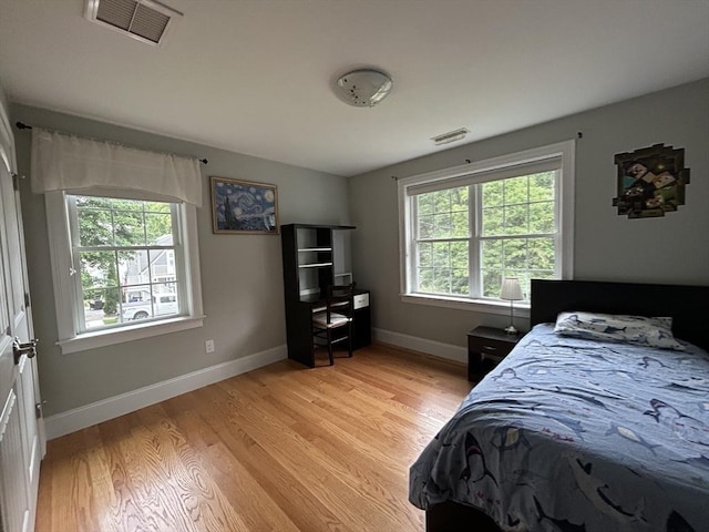 61 School St Unit B, Natick, MA 01760 - bedroom featuring light wood finished floors and baseboards