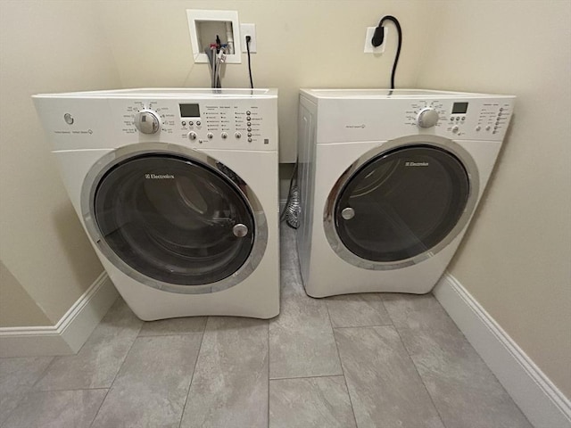61 School St Unit B, Natick, MA 01760 - laundry area featuring washing machine and clothes dryer and light tile patterned floors