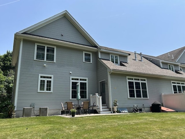 61 School St Unit B, Natick, MA 01760 - rear view of house featuring a yard, a patio, roof with shingles, and entry steps