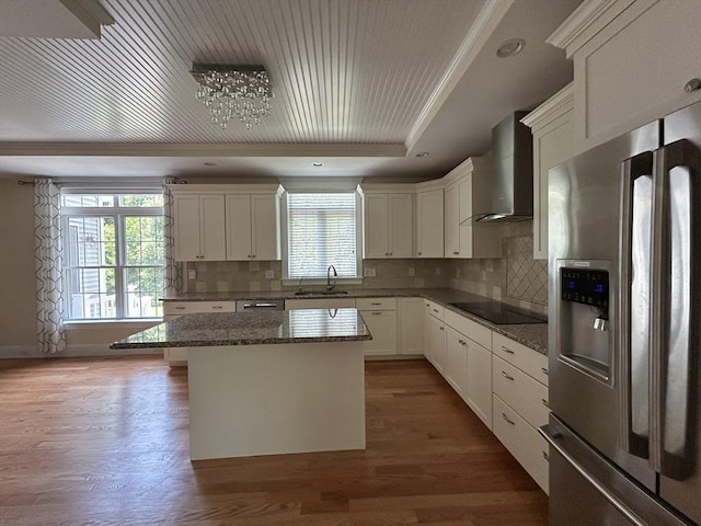 61 School St Unit B, Natick, MA 01760 - kitchen with stainless steel fridge, wall chimney exhaust hood, black electric stovetop, a tray ceiling, and wood finished floors