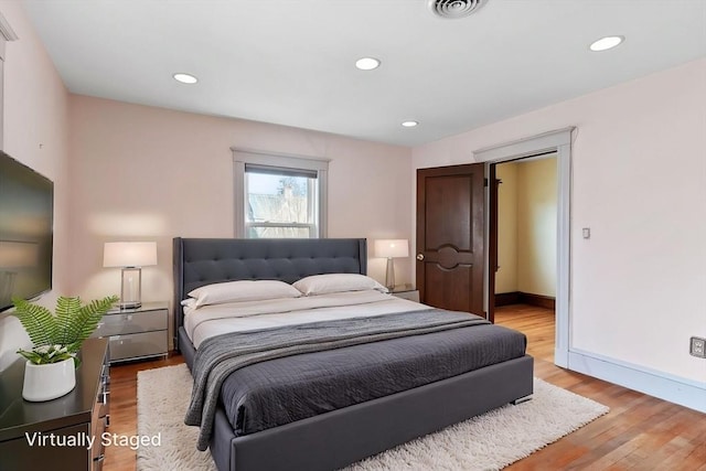 bedroom with recessed lighting, baseboards, visible vents, and light wood-style floors