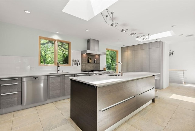 169 Hickory Rd, Weston, MA 02493 - kitchen featuring stainless steel dishwasher, a skylight, modern cabinets, a sink, and recessed lighting