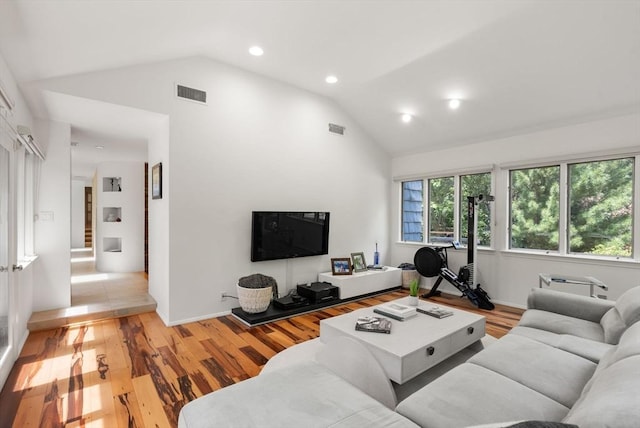 169 Hickory Rd, Weston, MA 02493 - living area with vaulted ceiling, light wood-type flooring, and recessed lighting