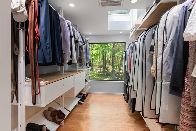 169 Hickory Rd, Weston, MA 02493 - walk in closet with light wood-style floors