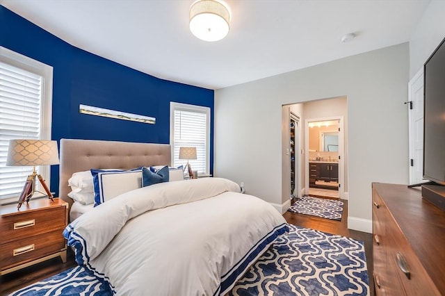101 Draper St Unit 3, Boston, MA 02122 - bedroom with baseboards, dark wood-style flooring, and ensuite bathroom